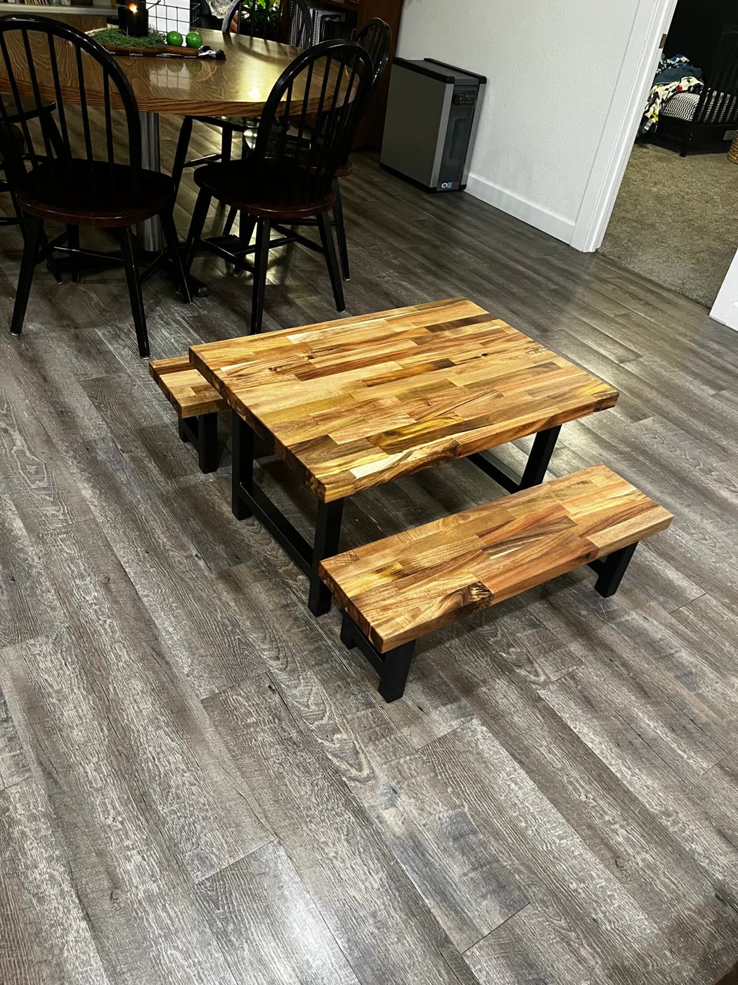 Kids table and bench set shown in a dining room
